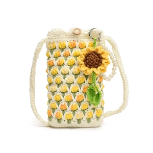 Handmade crochet crossbody bag with floral patterns, wooden button and pearl strap