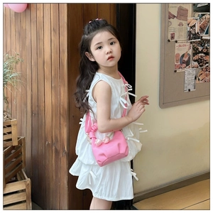 Detail of pink cloud bag with ruched handle and decorative tulip charms for kids