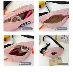 Close-up of pink canvas chest bag with SPORT patch, orange zipper, and internal storage
