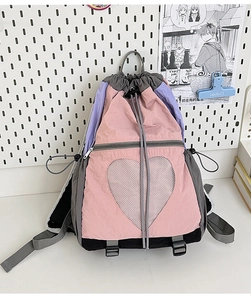Detail of multi-color drawstring backpack with heart-shaped mesh pocket and nylon texture