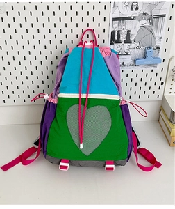 Detail of multi-color drawstring backpack with green heart-shaped mesh pocket design
