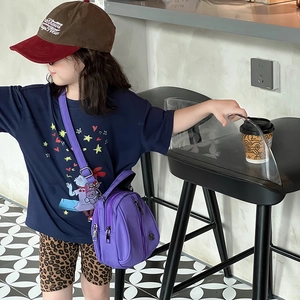Kids bright purple nylon crossbody bag with dual zippers and adjustable strap for sports