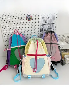 Three children backpacks with heart mesh pockets and colorful drawstring straps