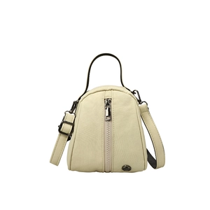 Minimalist beige shell crossbody bag for kids with durable fabric and metal hardware