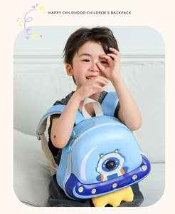 Blue hardshell kids backpack with 3D astronaut design and breathable mesh straps