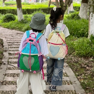 Kids heart pattern backpack with drawstring closure and mesh pockets for travel