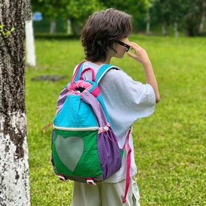 Childrens colorful drawstring backpack with heart mesh pocket and vibrant nylon straps