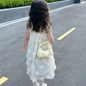 Kids yellow pleated cloud bag paired with a white floral relief summer dress for girls