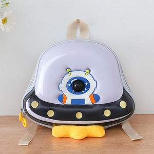UFO-shaped kids backpack with purple shell, astronaut print and yellow plush trim