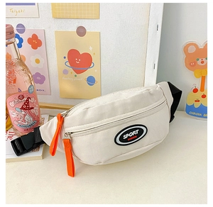 Detail of canvas chest bag with orange zipper, sport fashion patch and black strap