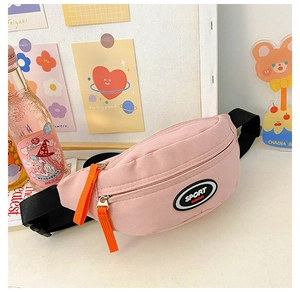 Detailed macro view of pink canvas chest bag with sport logo and orange zipper puller