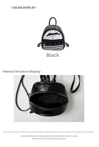 Internal compartment detail of black mini backpack with polka dots and bow accent