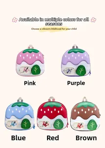 Five colorful strawberry-shaped toddler backpacks displayed in various vibrant colors