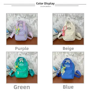 Mini solid color nylon kids shoulder bags in purple, beige, green, and blue color options