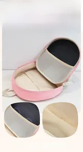 Detail view of pink mushroom backpack interior with multi-compartment storage design