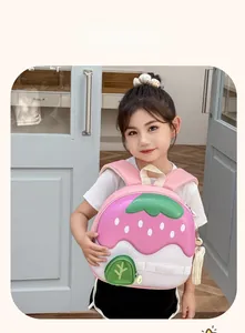 Detail view of pink strawberry hard-shell backpack for kids with wide straps