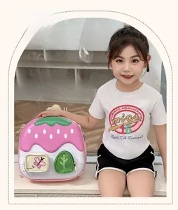 Detail of pink strawberry themed toddler backpack with leaf top and cute embroidery