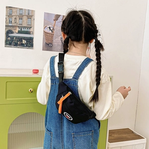 Kid's sporty black canvas chest bag with orange zippers and adjustable strap for casual travel