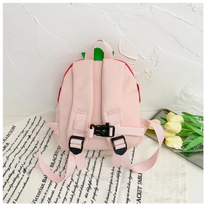 Detail of cute mushroom house kids backpack with breathable mesh back and pink straps