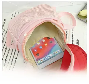 Internal view of a cute pink mushroom kids backpack showing iPad storage and soft lining