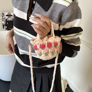 Handmade crochet mini tulip shoulder bag with pink floral patterns and pearl clasp
