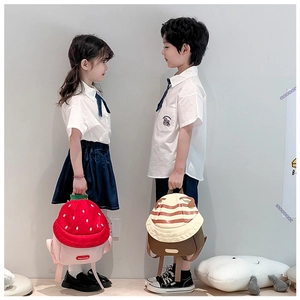 Close-up of strawberry and animal pattern backpacks for kindergarten children