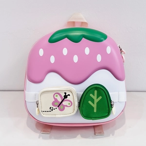 Detail view of pink mushroom house backpack with green leaf accents and cute pockets