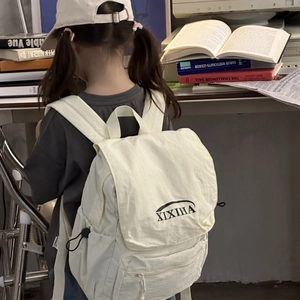 Creamy white large capacity school backpack for children featuring XIXIHA logo and drawstring