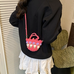 Handmade crochet mini tulip shoulder bag with pink knit floral pattern and pearl clasp