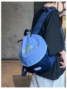 Outdoor view of child wearing blue mushroom house backpack with cosmic star patterns
