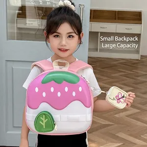 Cute strawberry shaped hardshell backpack for kids with a matching mini pouch charm