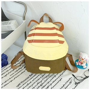 Detail of cute mushroom-shaped toddler backpack with TOCHASU logo and 3D ear accents