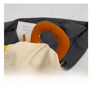 Close-up of comfortable padded orange handle on a colorful nylon school backpack
