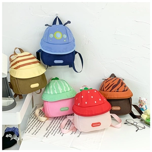 Collection of five colorful cartoon mini backpacks for kids featuring cute fruit and animal themes