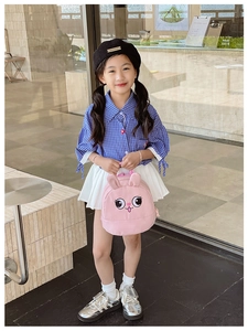 Detailed view of a cute pink rabbit toddler backpack featuring 3D ears and soft fabric straps