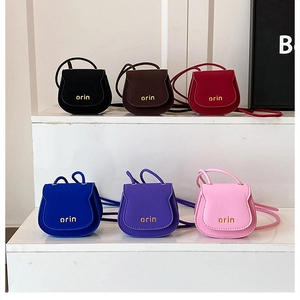 Mini saddle crossbody bags in six colors with gold orin logo and slim shoulder straps