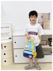 Detail of cute panda cartoon airplane backpack with side pockets and yellow handle