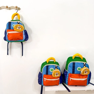 Three sizes of color-block kids backpacks with cute lion pendants and nylon fabric