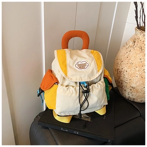 Detail of color-block nylon backpack with adjustable drawstring and fashion patch