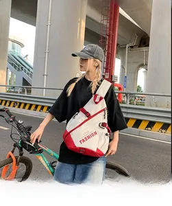 Outdoor shot of contrast color sling bag for women with adjustable strap and zip pocket