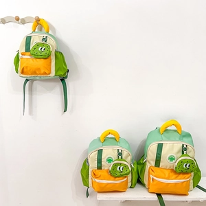 Detailed set of color-blocked school backpacks with cartoon pendants in three sizes