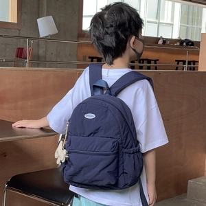 Kids navy blue outdoor backpack with plush bunny charm and large capacity for travel