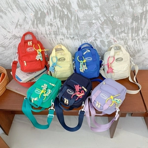 Kids Mini Crossbody Bag Nylon Solid Color Adjustable Strap Small Shoulder Pouch With Decorative Puzzle Charm
