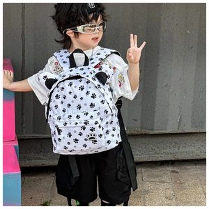 Close-up of cute panda ears and paw badge detail on the leopard print kids backpack