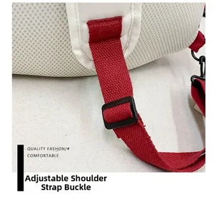 Detail of red woven shoulder strap with black adjustment buckle and breathable mesh back