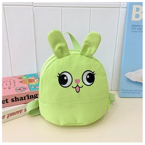 Detail of light green rabbit backpack showing cute embroidery and plush bunny ears