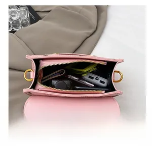 Pink crossbody bag interior view showing large capacity for phone and cosmetics