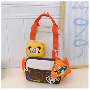 Detail of cute panda backpack for kids featuring aircraft motifs and accessory pouch