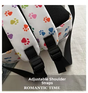 Detail of adjustable straps with colorful paw prints and breathable mesh on backpack