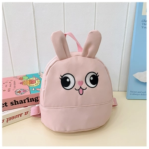 Detailed embroidery of cute cartoon rabbit ears and face on a pink toddler backpack